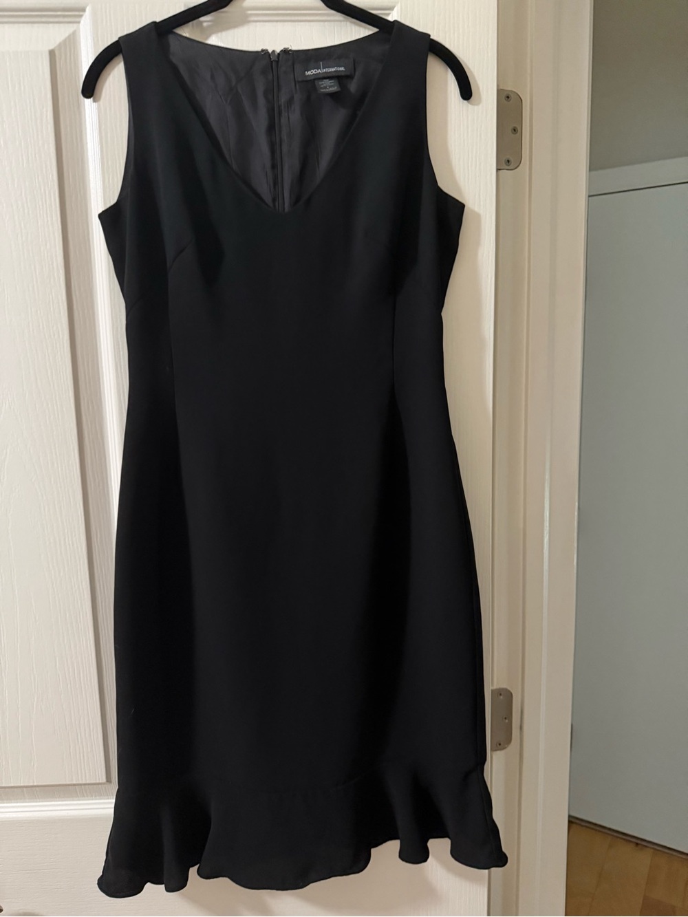Moda International Black Sleeveless V-Neck Mini Dress with Flounce Hem